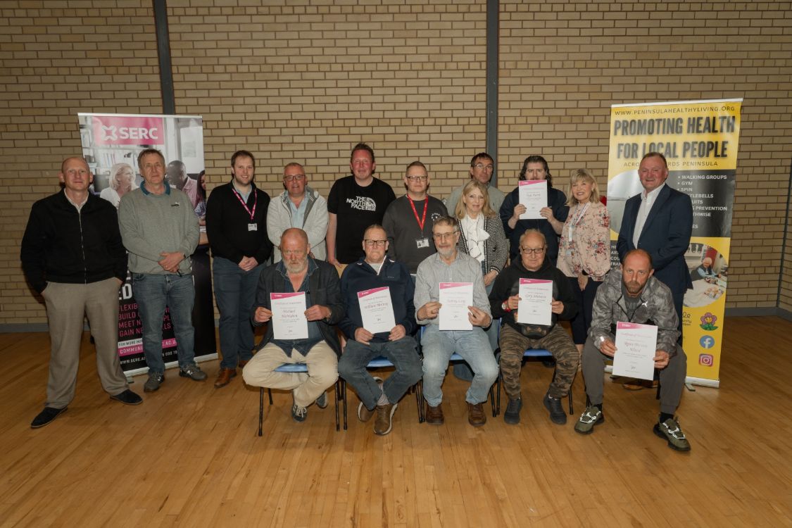 Participants of the joinery course celebrate their success.